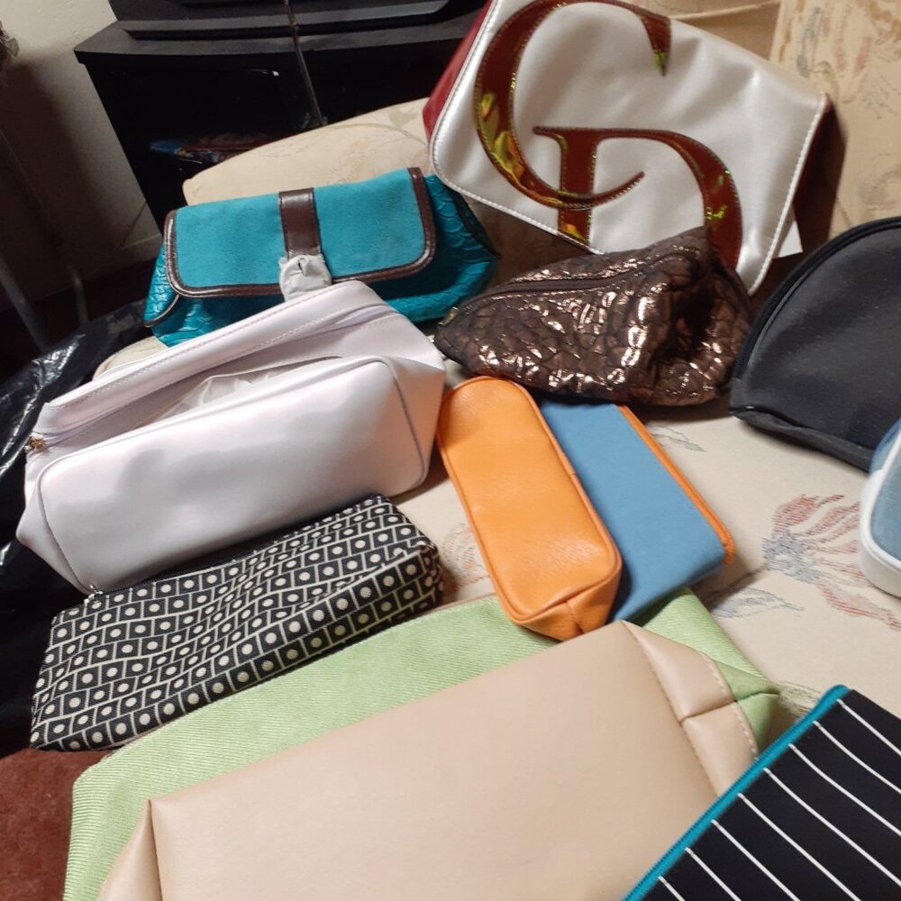assortment of women makeup bag and purse